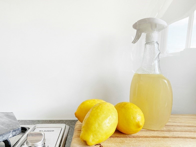 Lemons next to a spray bottle and lemons

Description automatically generated